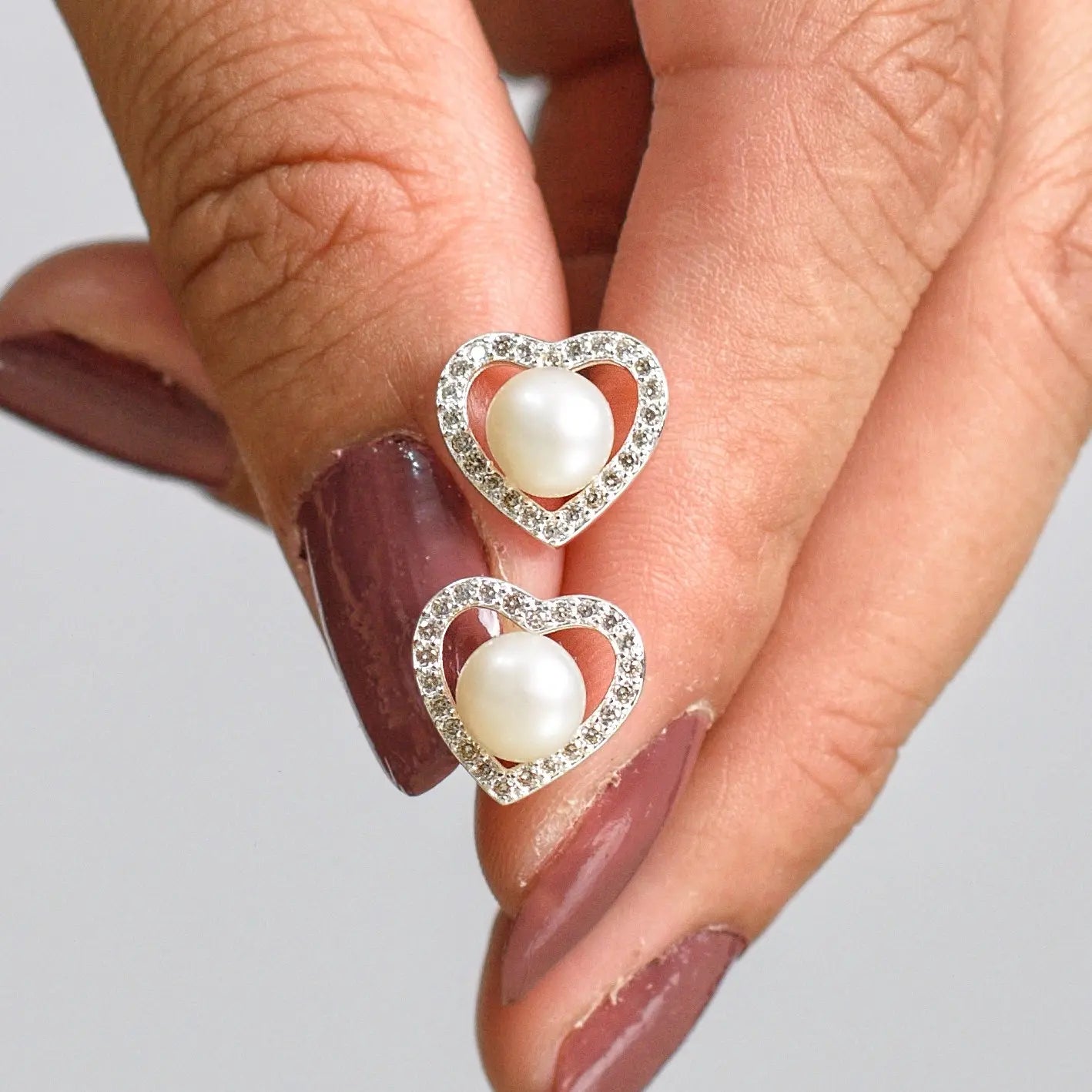 Aros plata 925 Alba para mujer en mano